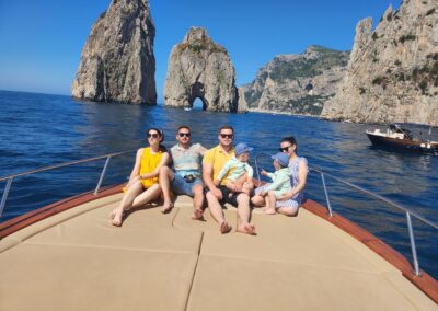 Photo taken off the coast of Capri's Faraglioni. Families with children on board.