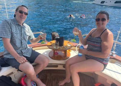 couple in a private boat, for hire, toasting the wonderful experience
