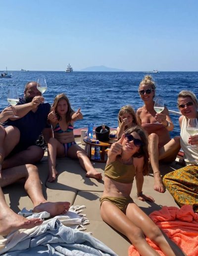 families, friends, toasting on the stern of the rented gozzo, off the coast of Capri